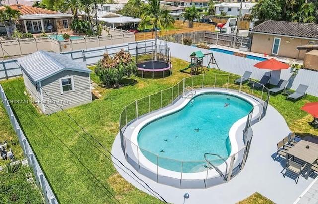 a view of a swimming pool with a patio