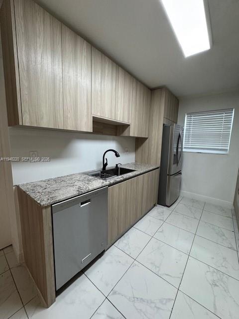 211 Southeast 3rd Street Dania Beach, FL 33004 - Photo 7 of 20 a kitchen with stainless steel appliances granite countertop a refrigerator sink and cabinets
