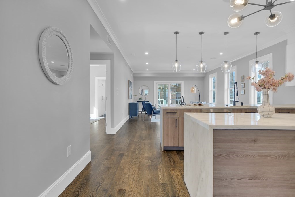 91 Parkton Road, Unit 1 Boston, MA 02130 - Photo 5 of 35 a view of a kitchen with furniture and a chandelier