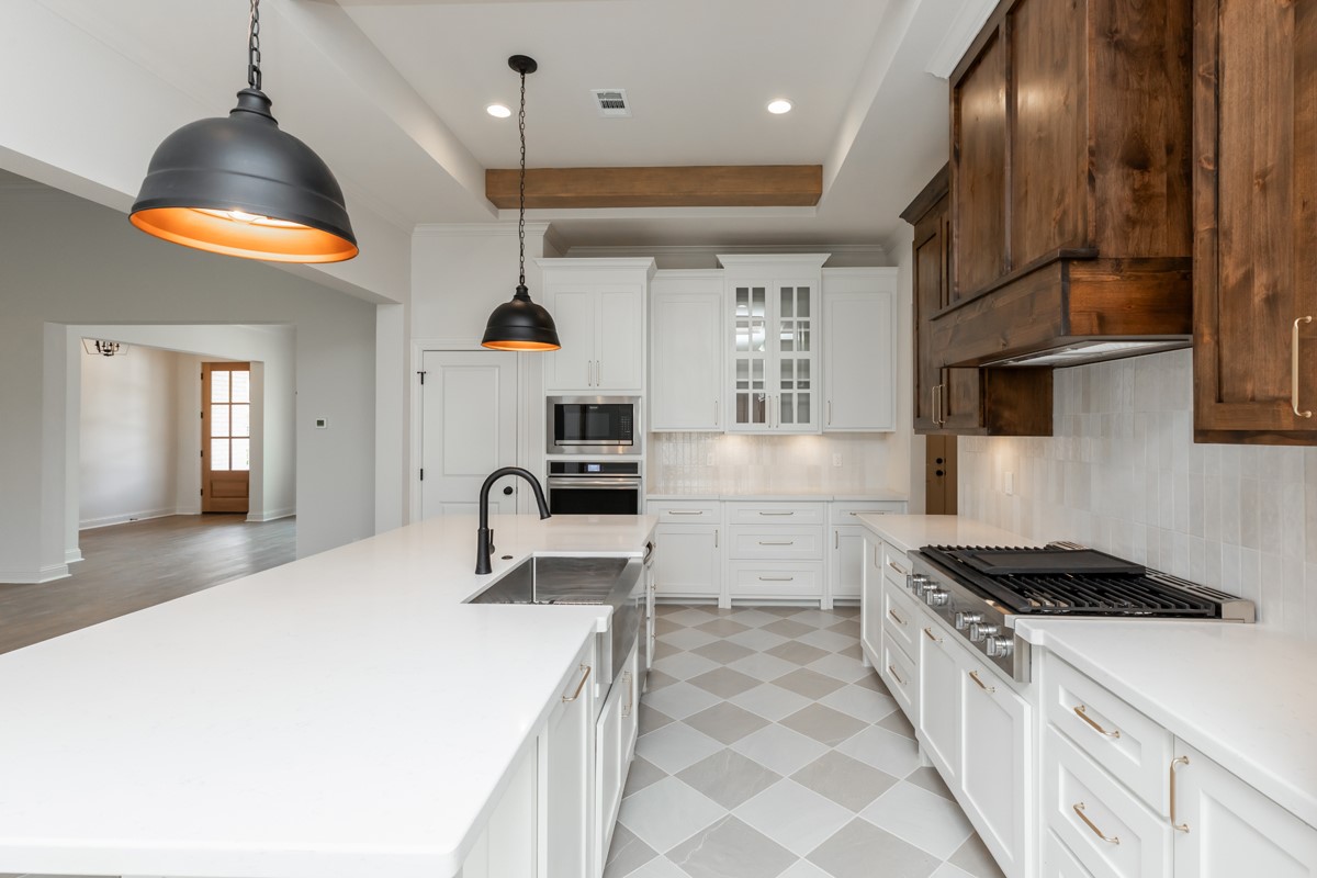 6560 Brayfield Lane Beaumont, TX 77706 - Photo 11 of 38 a kitchen with stainless steel appliances granite countertop a sink a stove and a refrigerator