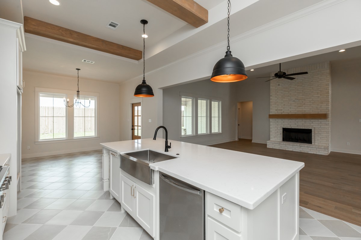 6560 Brayfield Lane Beaumont, TX 77706 - Photo 13 of 38 a kitchen with a sink and a stove