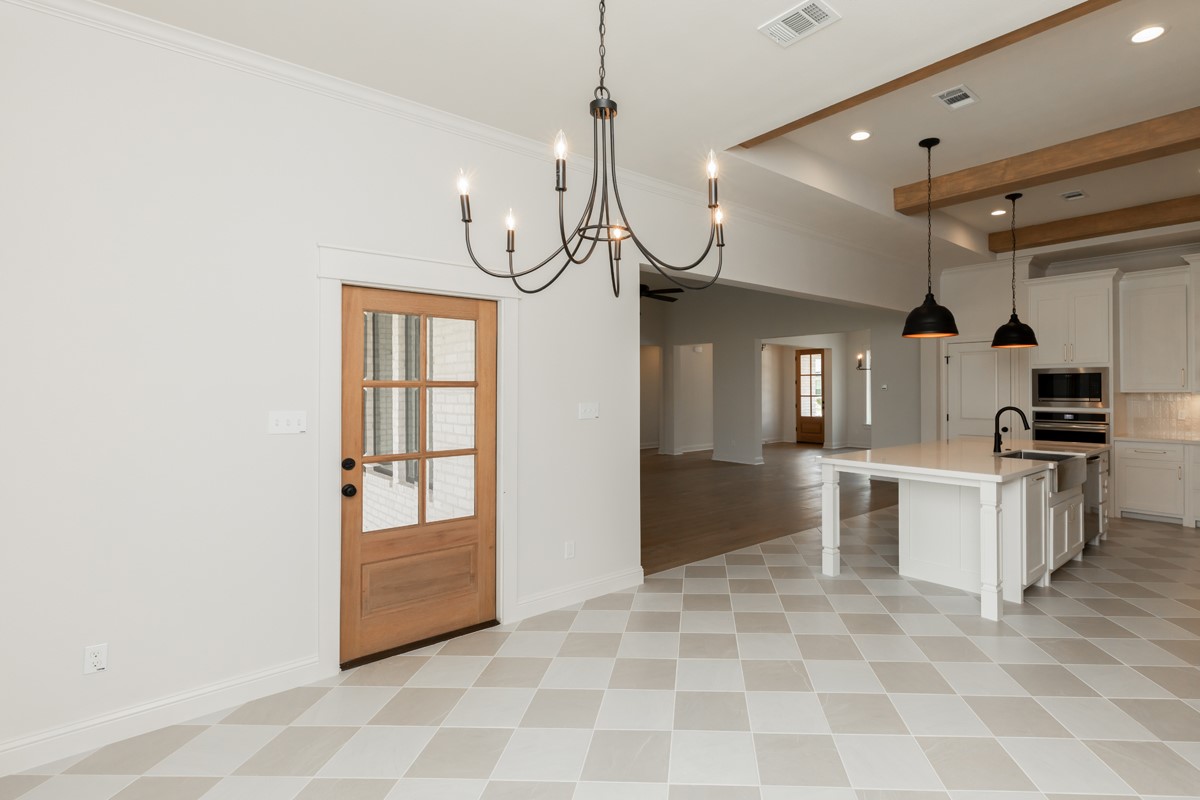 6560 Brayfield Lane Beaumont, TX 77706 - Photo 25 of 38 a view of a kitchen with microwave and cabinets