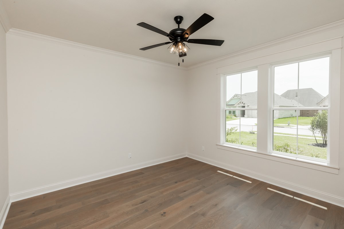 6560 Brayfield Lane Beaumont, TX 77706 - Photo 29 of 38 wooden floor in an empty room with a window