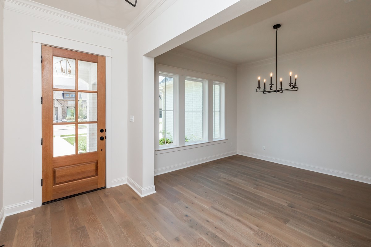 6560 Brayfield Lane Beaumont, TX 77706 - Photo 3 of 38 a view of a room with wooden floor and windows