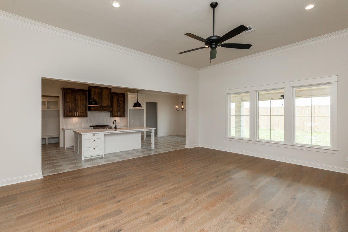 6560 Brayfield Lane Beaumont, TX 77706 - Photo 7 of 38 a view of a livingroom with a kitchen and a stove top oven