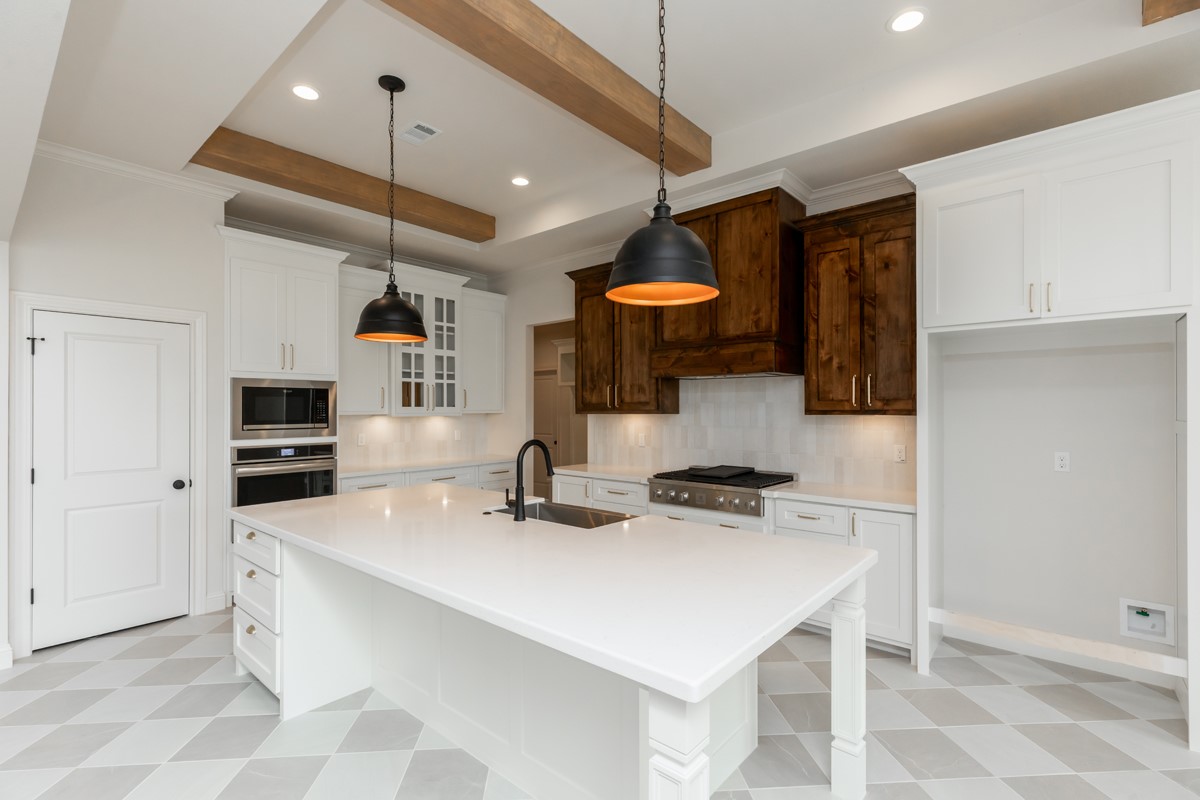 6560 Brayfield Lane Beaumont, TX 77706 - Photo 10 of 38 a kitchen with stainless steel appliances a sink a stove a refrigerator and cabinets
