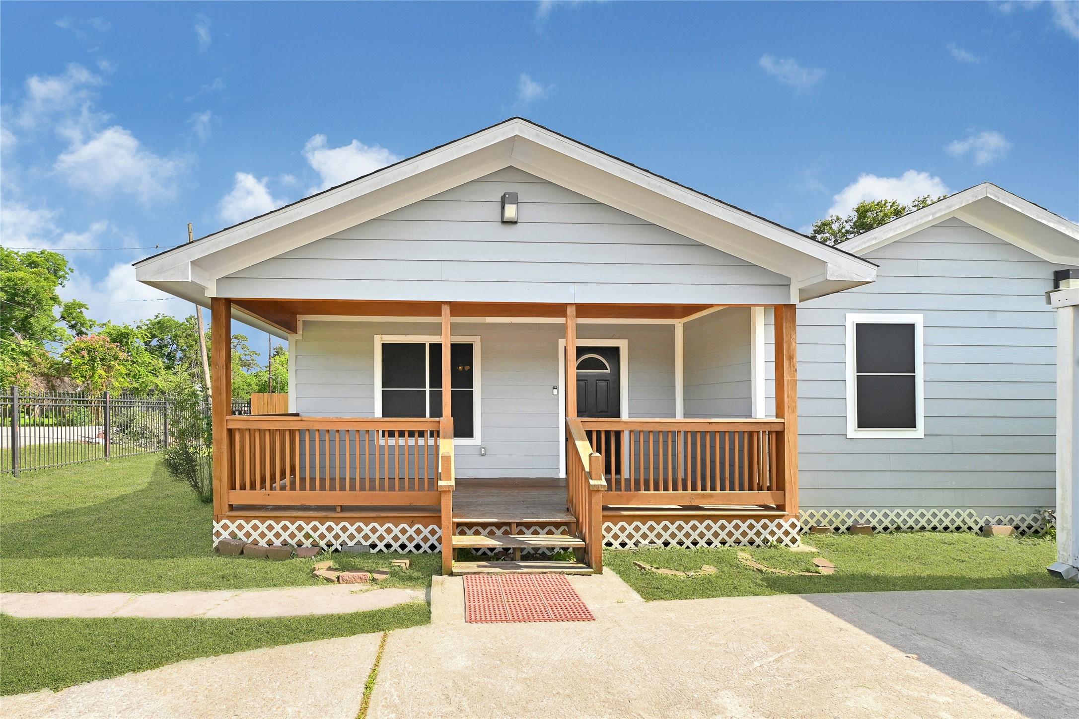 6825 Appleton Street Houston, TX 77022 - Photo 1 of 25 a front view of a house with a garden