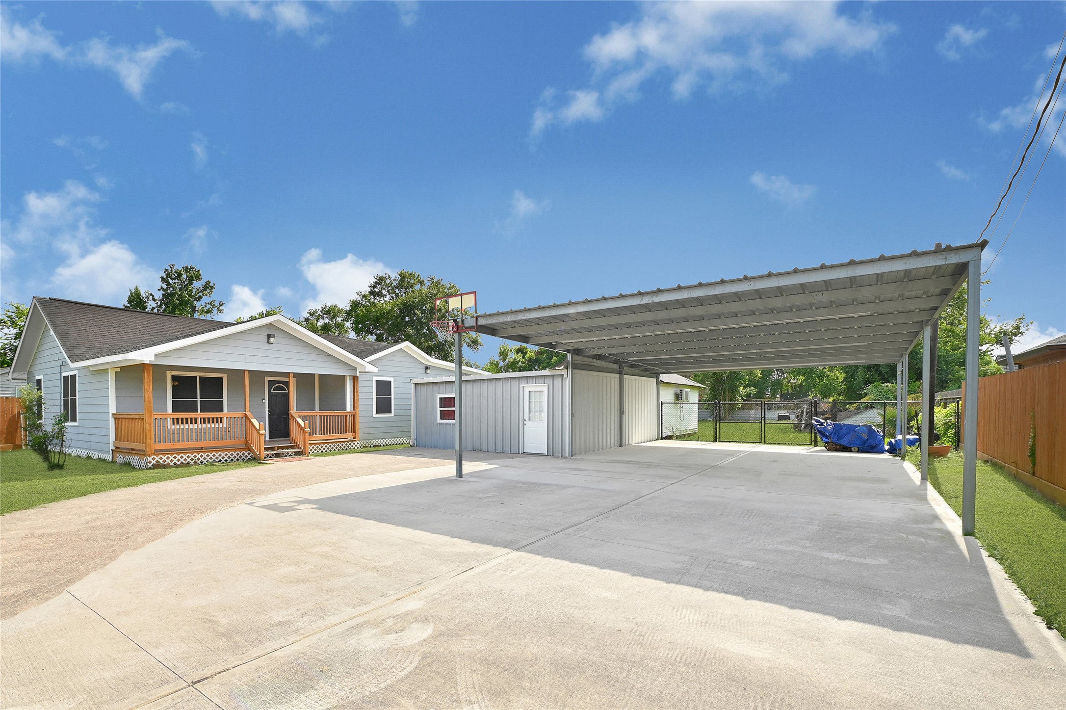 6825 Appleton Street Houston, TX 77022 - Photo 2 of 25 a front view of a house with a yard and potted plants