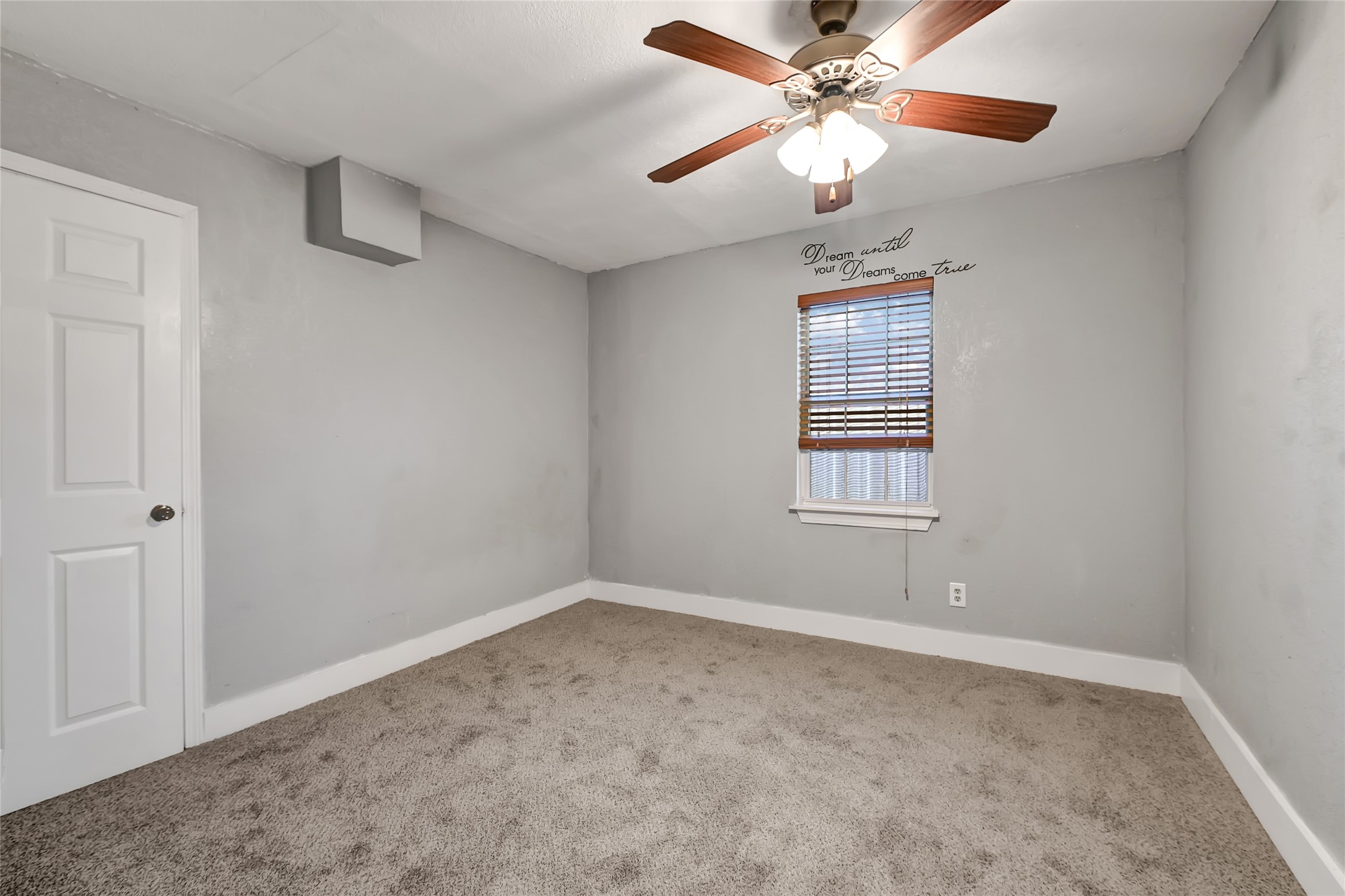 6825 Appleton Street Houston, TX 77022 - Photo 10 of 25 a view of an empty room with a window