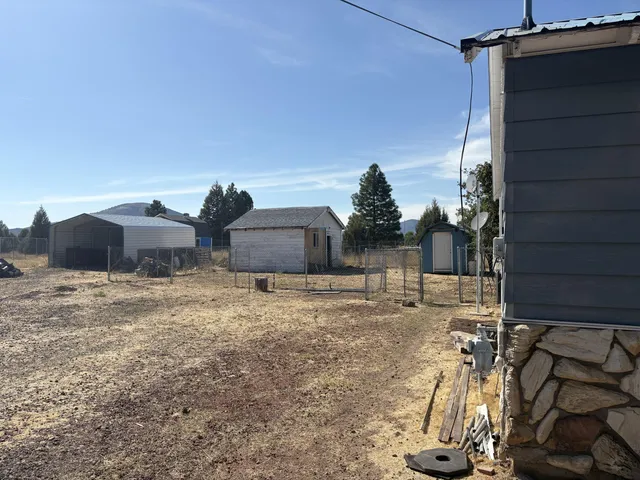 a house view with a backyard space