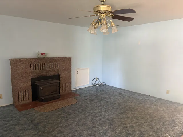 an empty room with a fireplace
