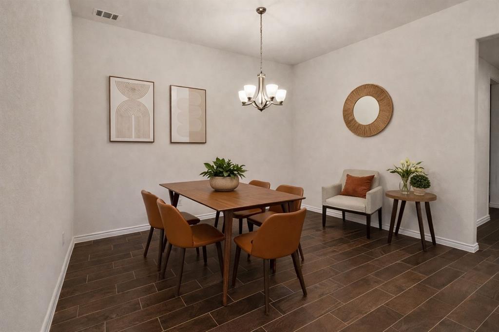 3106 Maverick Drive Forney, TX 75126 - Photo 8 of 32 a view of a dining room with furniture and chandelier