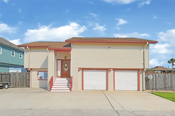 a front view of a house with a garage