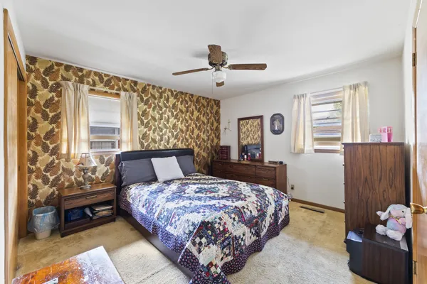 a bed room with a bed and a couch