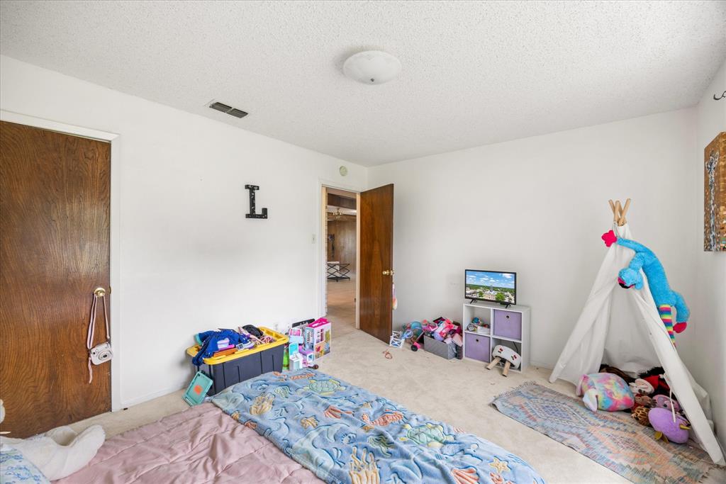 4210 Waples Road Granbury, TX 76049 - Photo 35 of 37 Carpeted room featuring white walls and a white textured ceiling