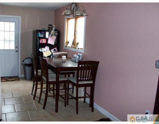 33 West Knollwood Road Edison, NJ 08817 - Photo 2 of 9 a dining room with furniture and window