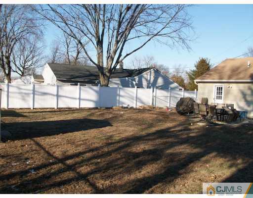 33 West Knollwood Road Edison, NJ 08817 - Photo 8 of 9 a view of a house with a yard
