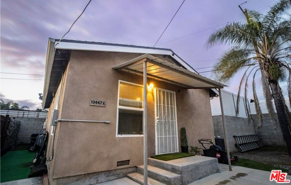 13447 Filmore Street Pacoima, CA 91331 - Photo 8 of 12 a backyard of a house with seating space