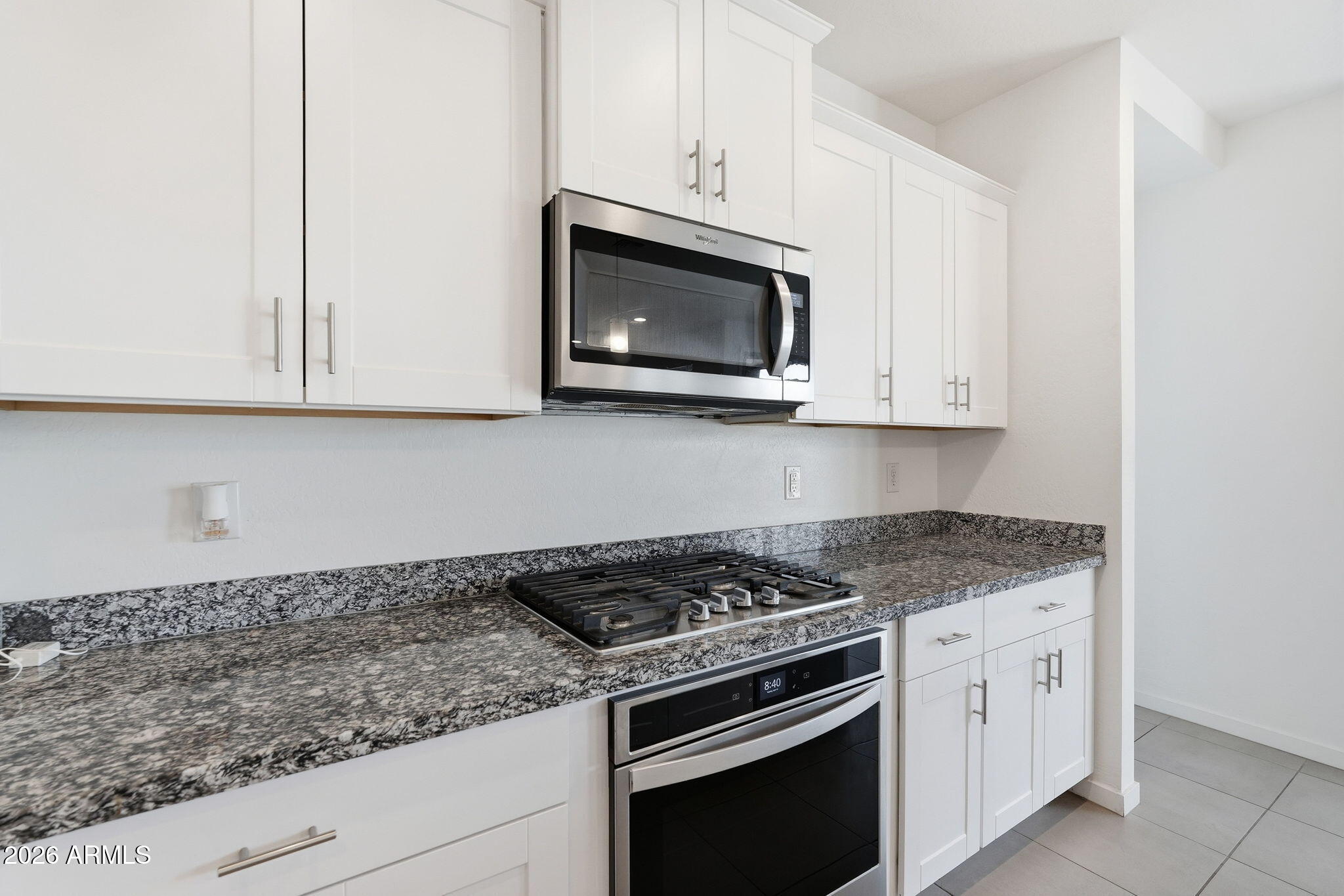 5621 West Notch Hill Road Laveen, AZ 85339 - Photo 11 of 49 a kitchen with granite countertop white cabinets stainless steel appliances and a sink