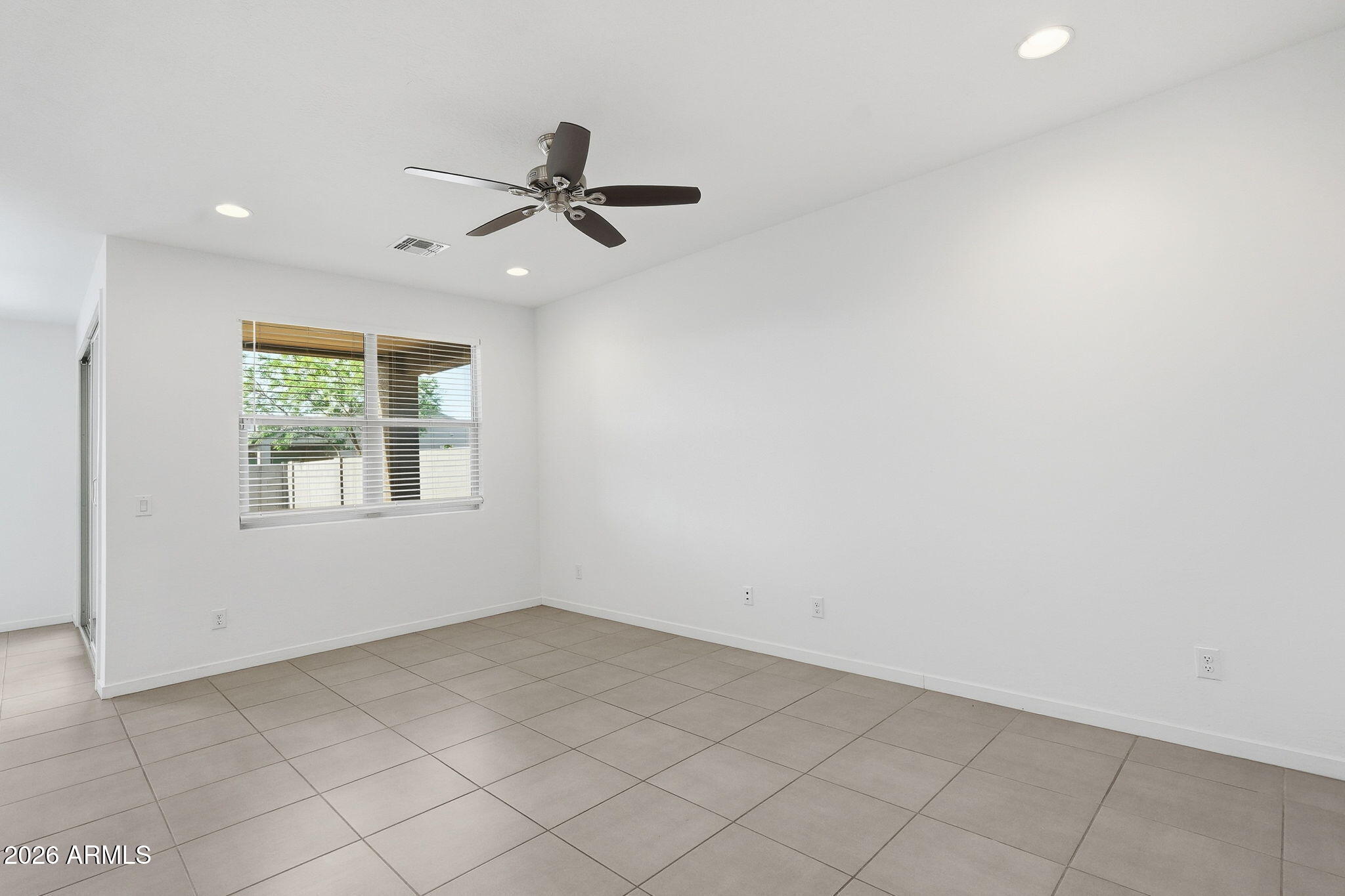 5621 West Notch Hill Road Laveen, AZ 85339 - Photo 14 of 49 an empty room with a window
