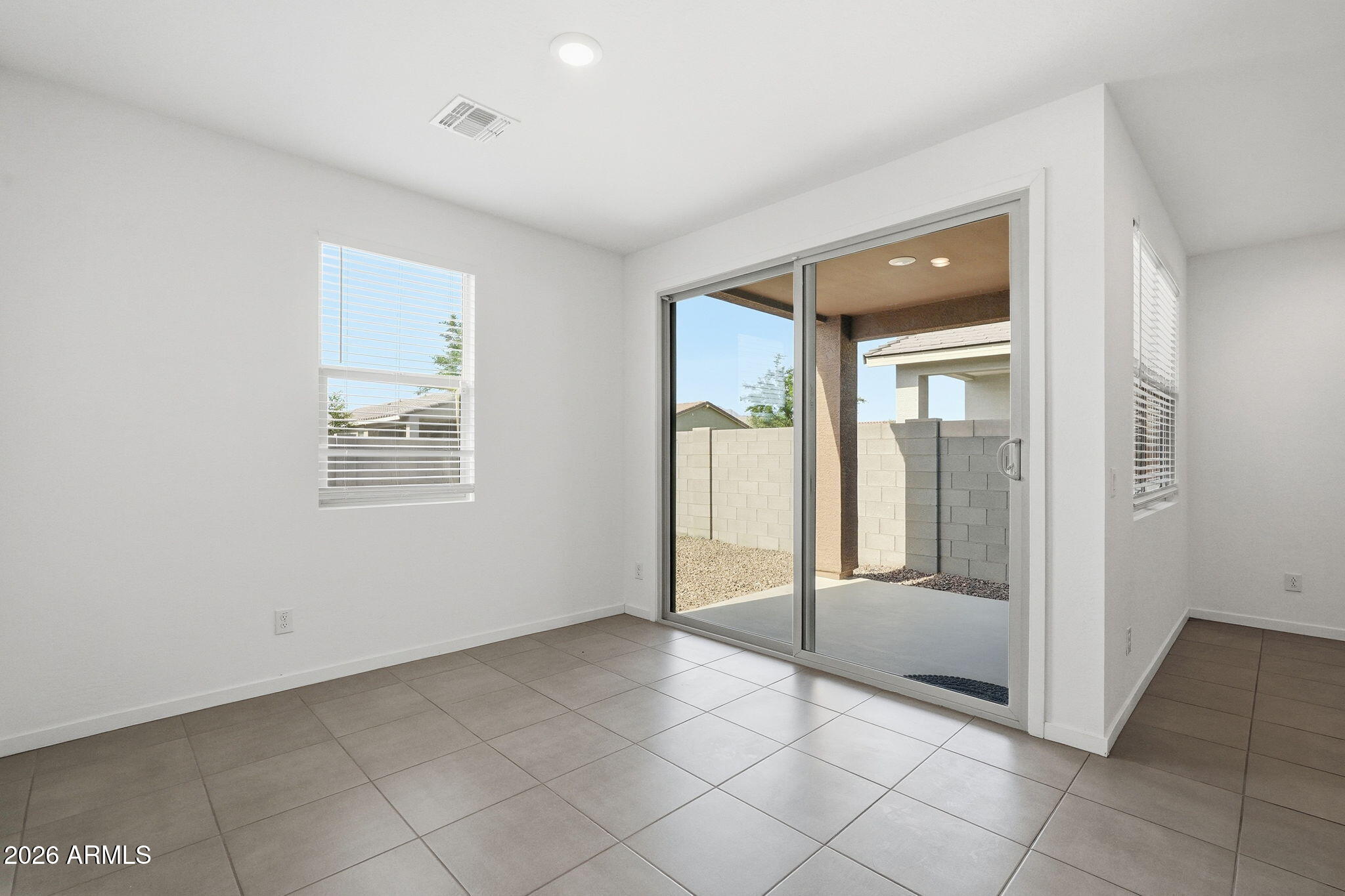 5621 West Notch Hill Road Laveen, AZ 85339 - Photo 16 of 49 an empty room with entrance and windows