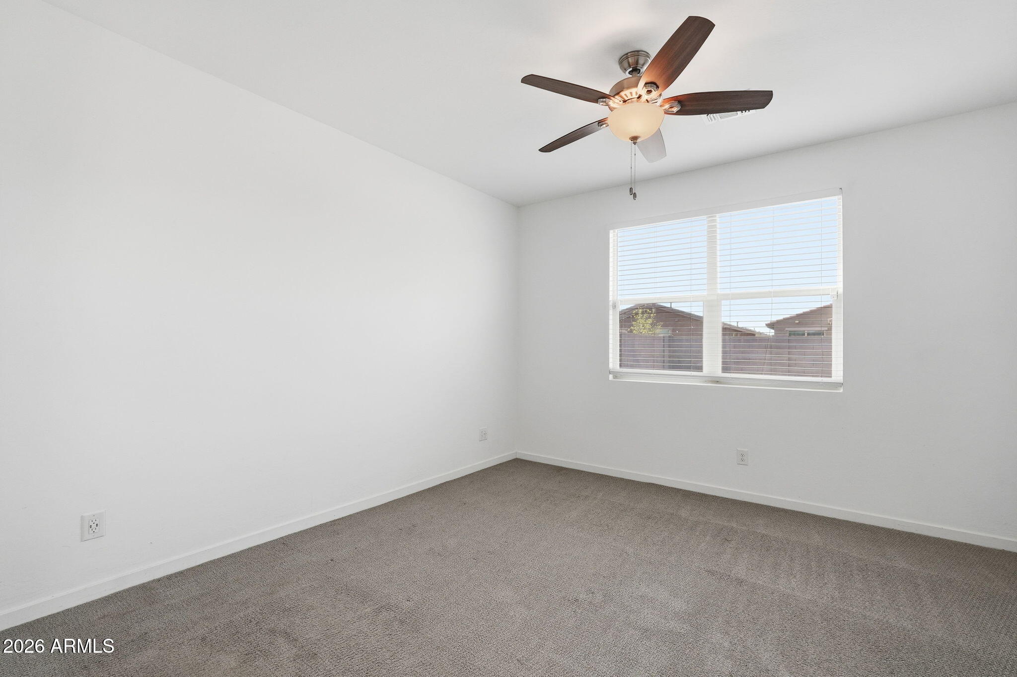 5621 West Notch Hill Road Laveen, AZ 85339 - Photo 20 of 49 an empty room with a window and a ceiling fan