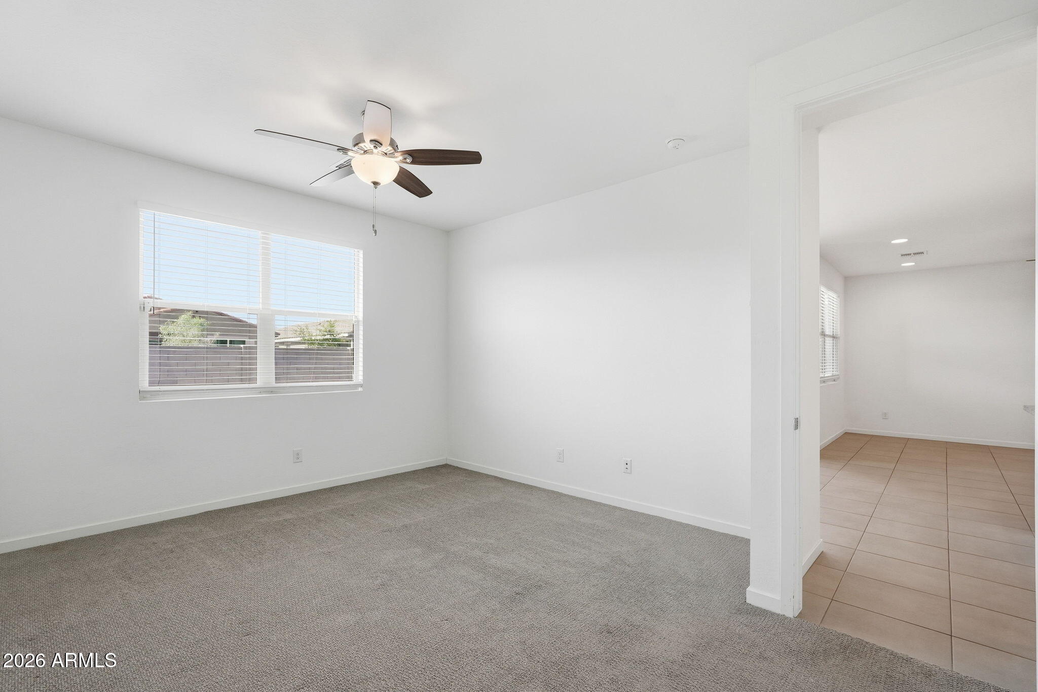 5621 West Notch Hill Road Laveen, AZ 85339 - Photo 22 of 49 an empty room with windows and fan