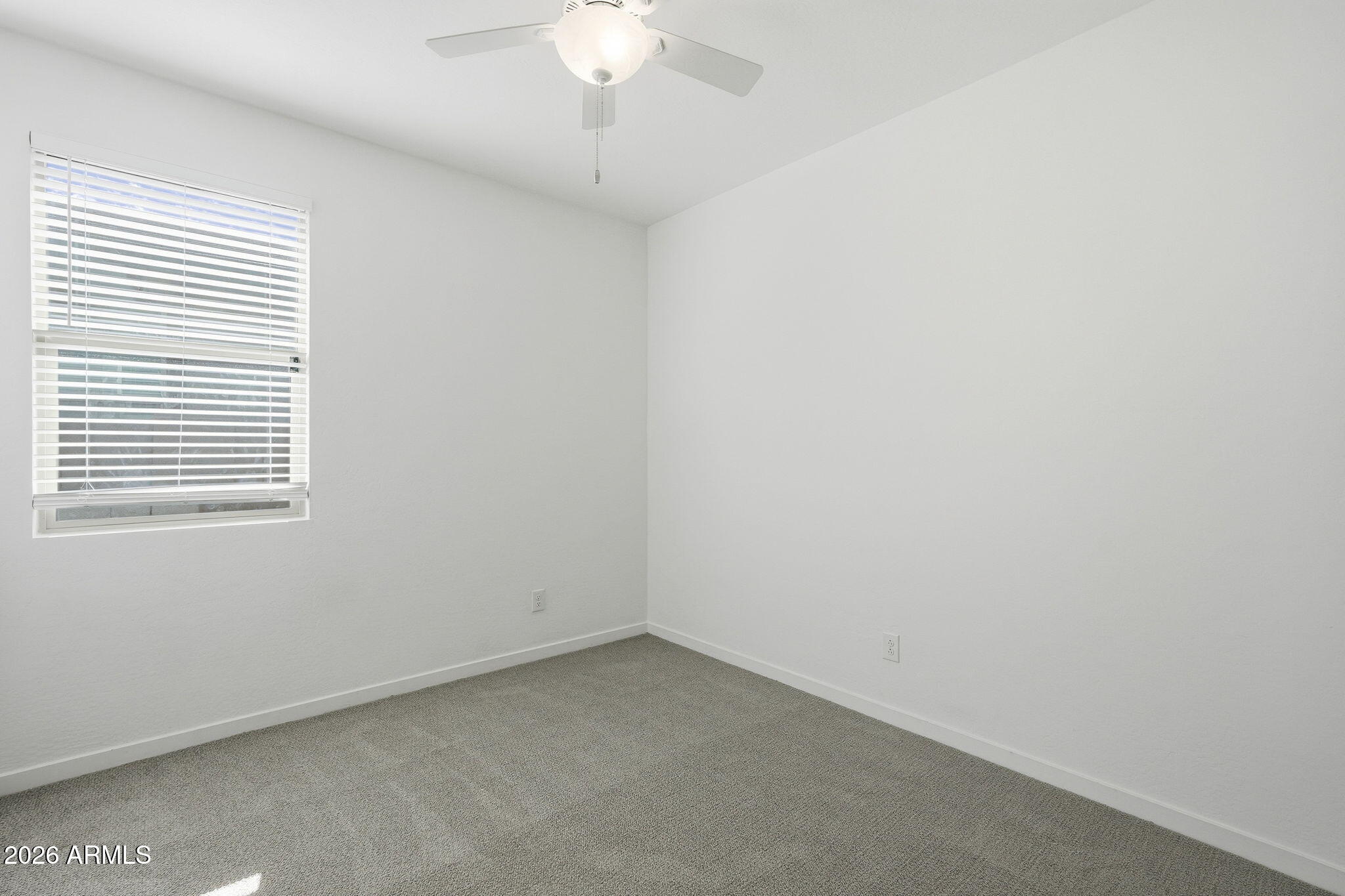 5621 West Notch Hill Road Laveen, AZ 85339 - Photo 23 of 49 en empty room with a window