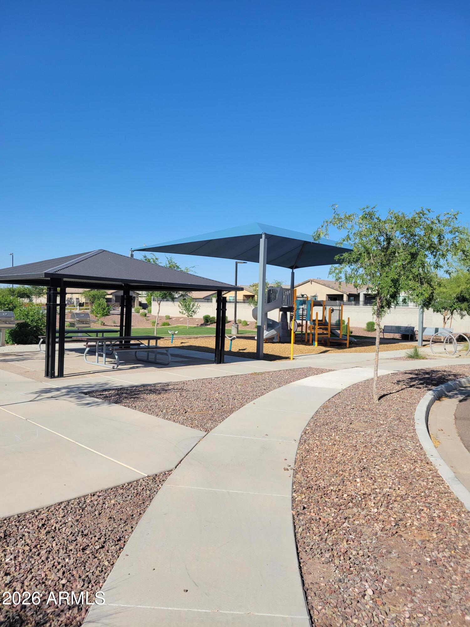 5621 West Notch Hill Road Laveen, AZ 85339 - Photo 48 of 49 a swimming pool with outdoor seating and yard