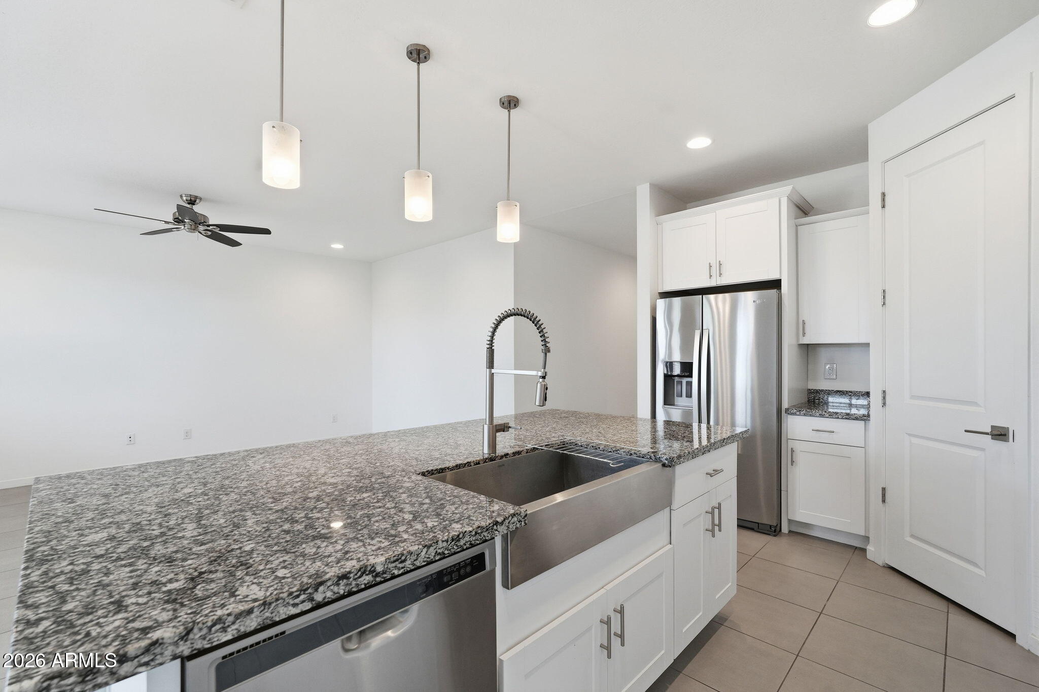 5621 West Notch Hill Road Laveen, AZ 85339 - Photo 9 of 49 a kitchen with stainless steel appliances granite countertop a sink and a refrigerator