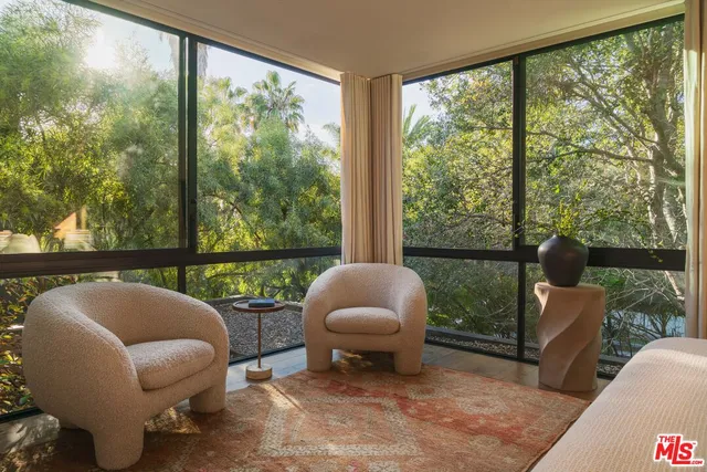 a outdoor living space with furniture and a floor to ceiling window