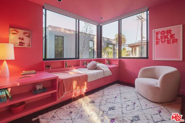 a bedroom with a bed and a couch