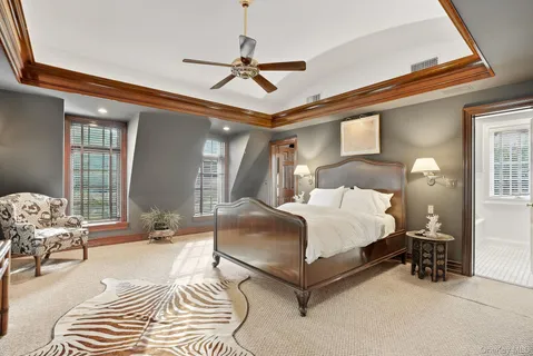 a bathroom with a tub sink and a mirror