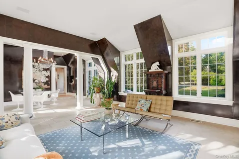 a living room with furniture and large window