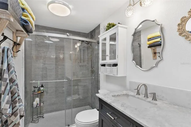 a view of a dining room with furniture wooden floor and chandelier