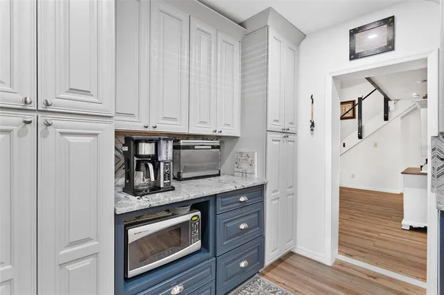 a front view of a house with a garden and porch