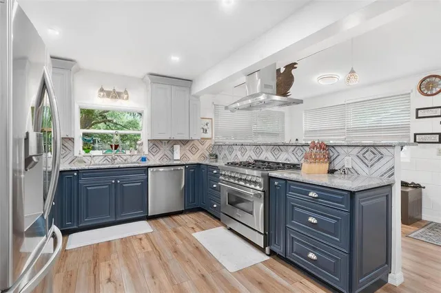 a view of a livingroom with workspace and a window