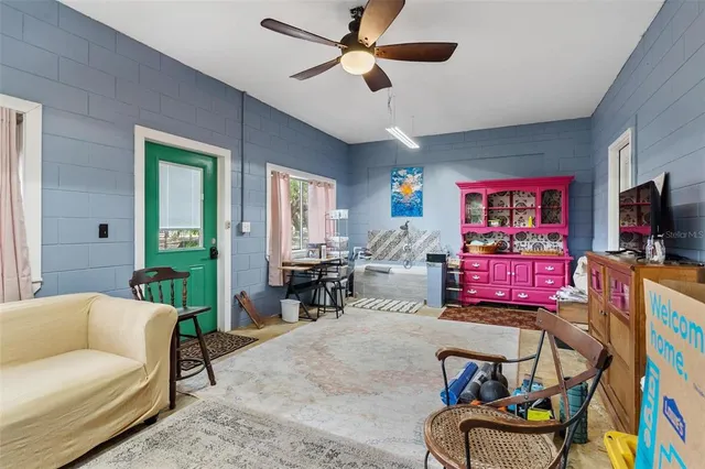 an aerial view of a house with a yard and garden