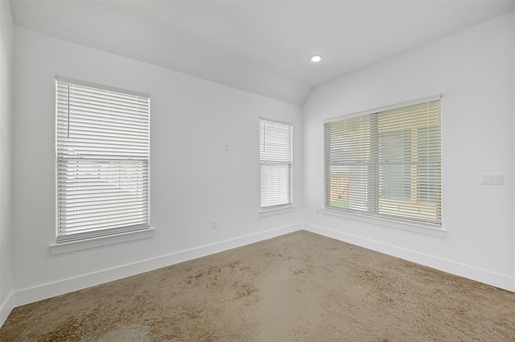 102 Cardinal Wds Granbury, TX 76049 - Photo 18 of 36 Unfurnished room featuring recessed lighting, concrete flooring, and lofted ceiling