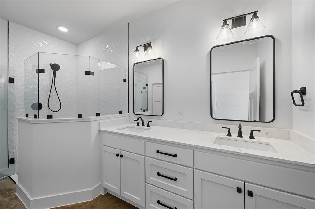 102 Cardinal Wds Granbury, TX 76049 - Photo 22 of 36 Bathroom with a stall shower and double vanity