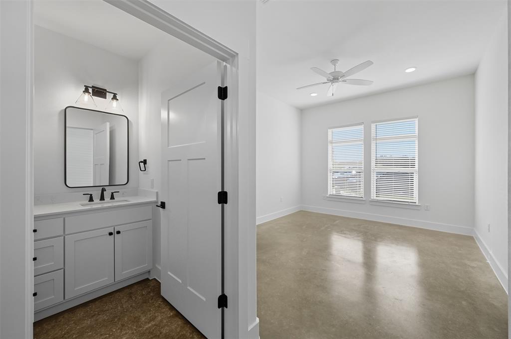 102 Cardinal Wds Granbury, TX 76049 - Photo 25 of 36 Bathroom with vanity, finished concrete floors, ceiling fan, and recessed lighting