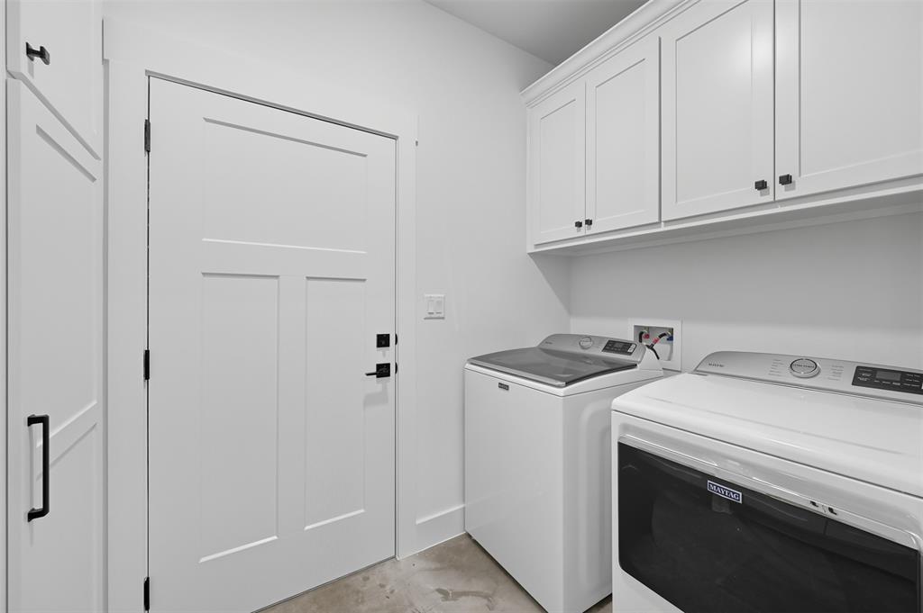 102 Cardinal Wds Granbury, TX 76049 - Photo 27 of 36 Laundry room featuring cabinet space and separate washer and dryer