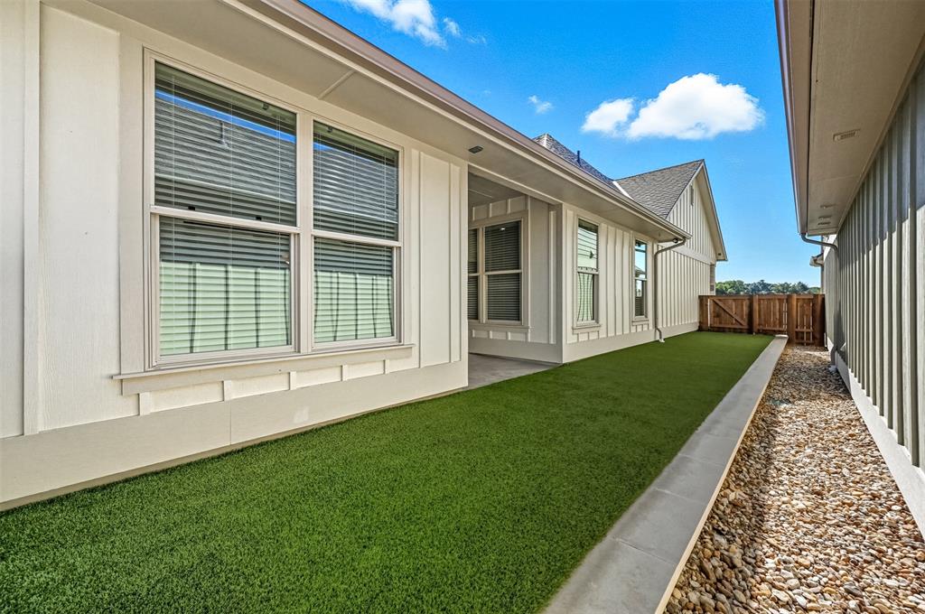 102 Cardinal Wds Granbury, TX 76049 - Photo 28 of 36 Fenced backyard with a patio