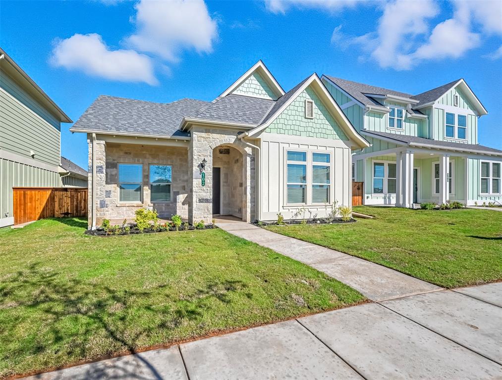 102 Cardinal Wds Granbury, TX 76049 - Photo 3 of 36 View of front of home with board and batten siding, stone siding, and a shingled roof