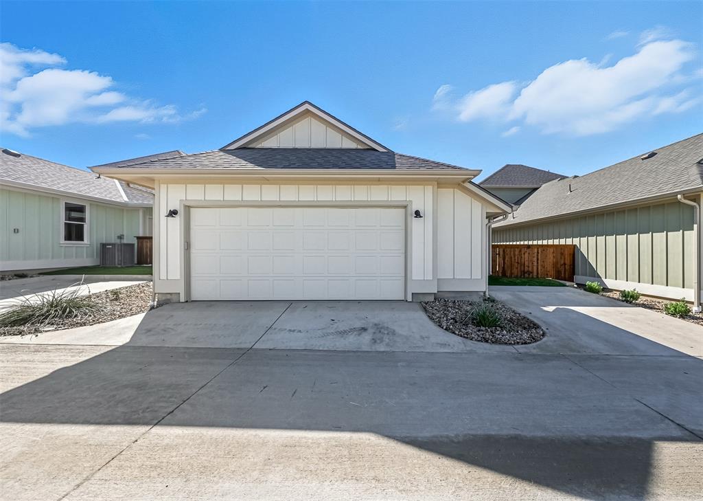 102 Cardinal Wds Granbury, TX 76049 - Photo 31 of 36 Garage with driveway