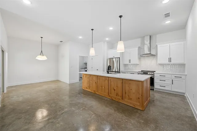 a large kitchen with cabinets
