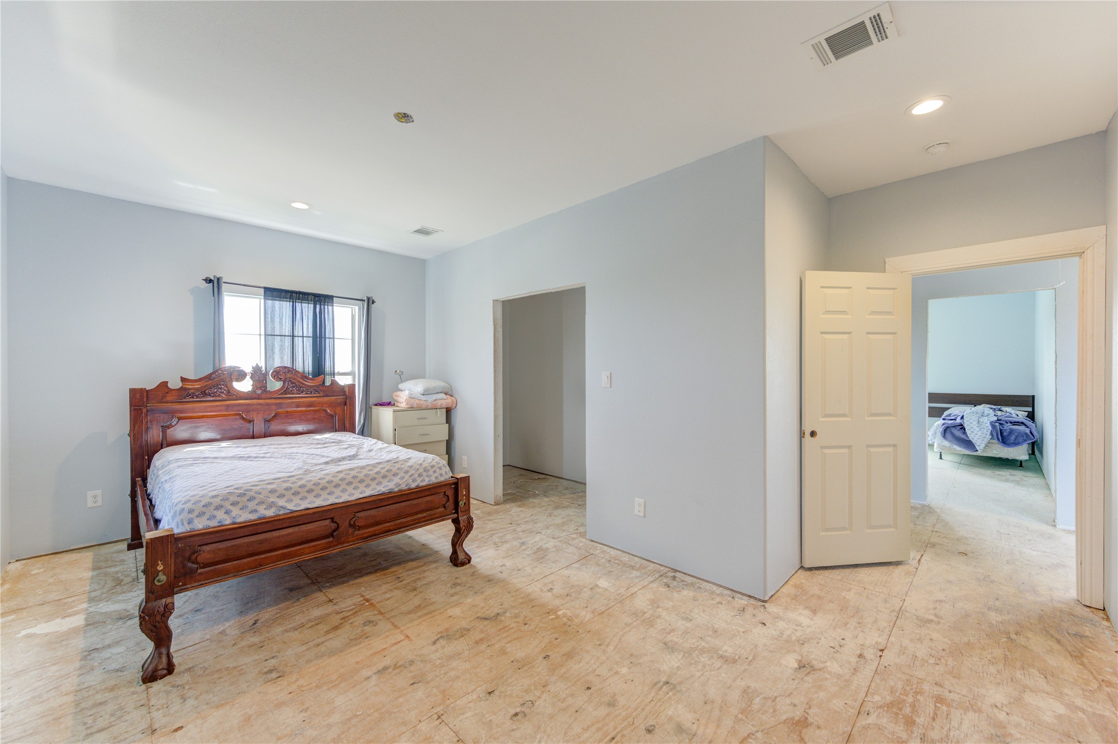 8570 Sunny Side Road Hempstead, TX 77445 - Photo 12 of 50 a spacious bedroom with a bed and a cabinets