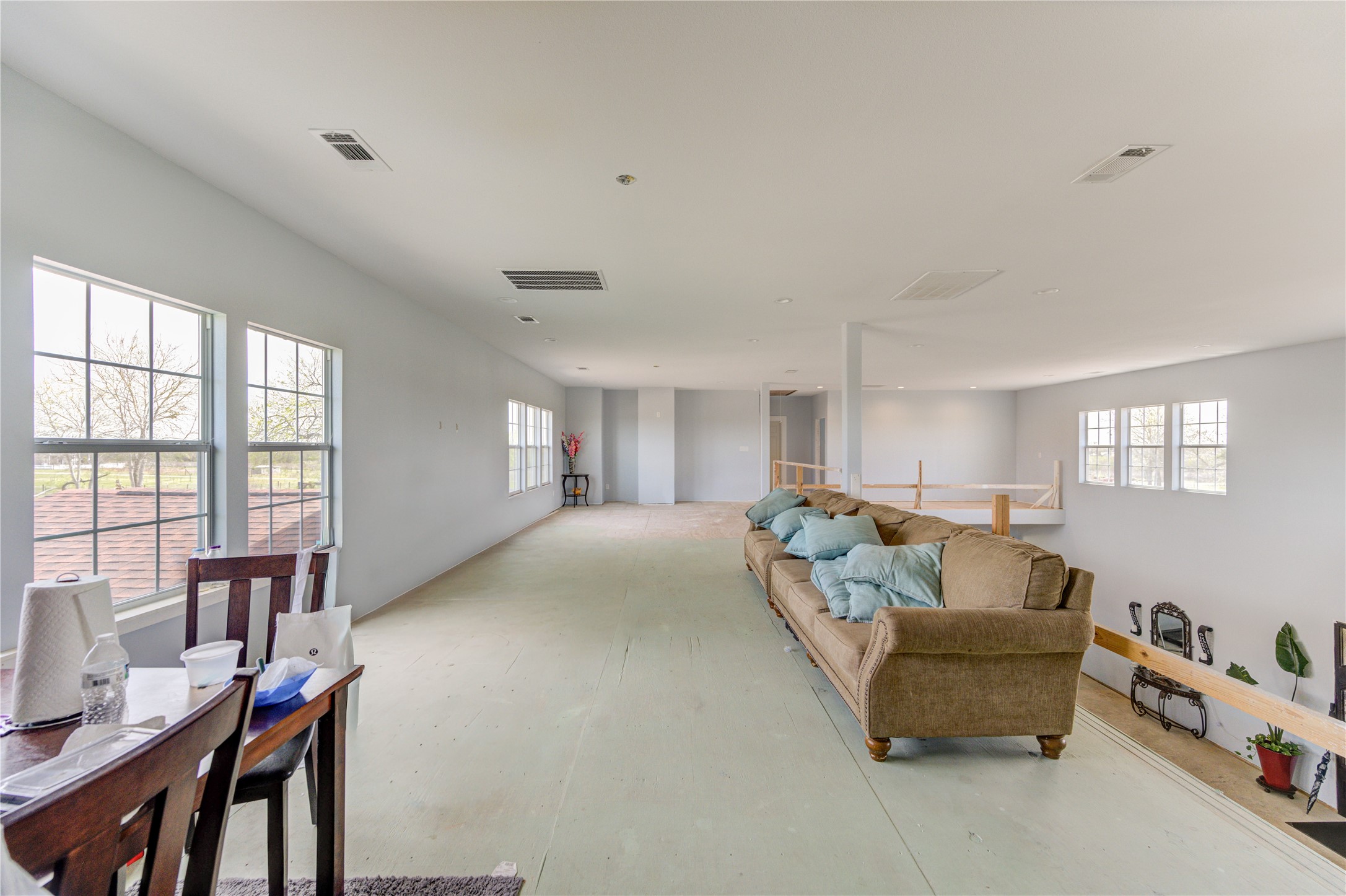 8570 Sunny Side Road Hempstead, TX 77445 - Photo 18 of 50 a living room with furniture and large windows