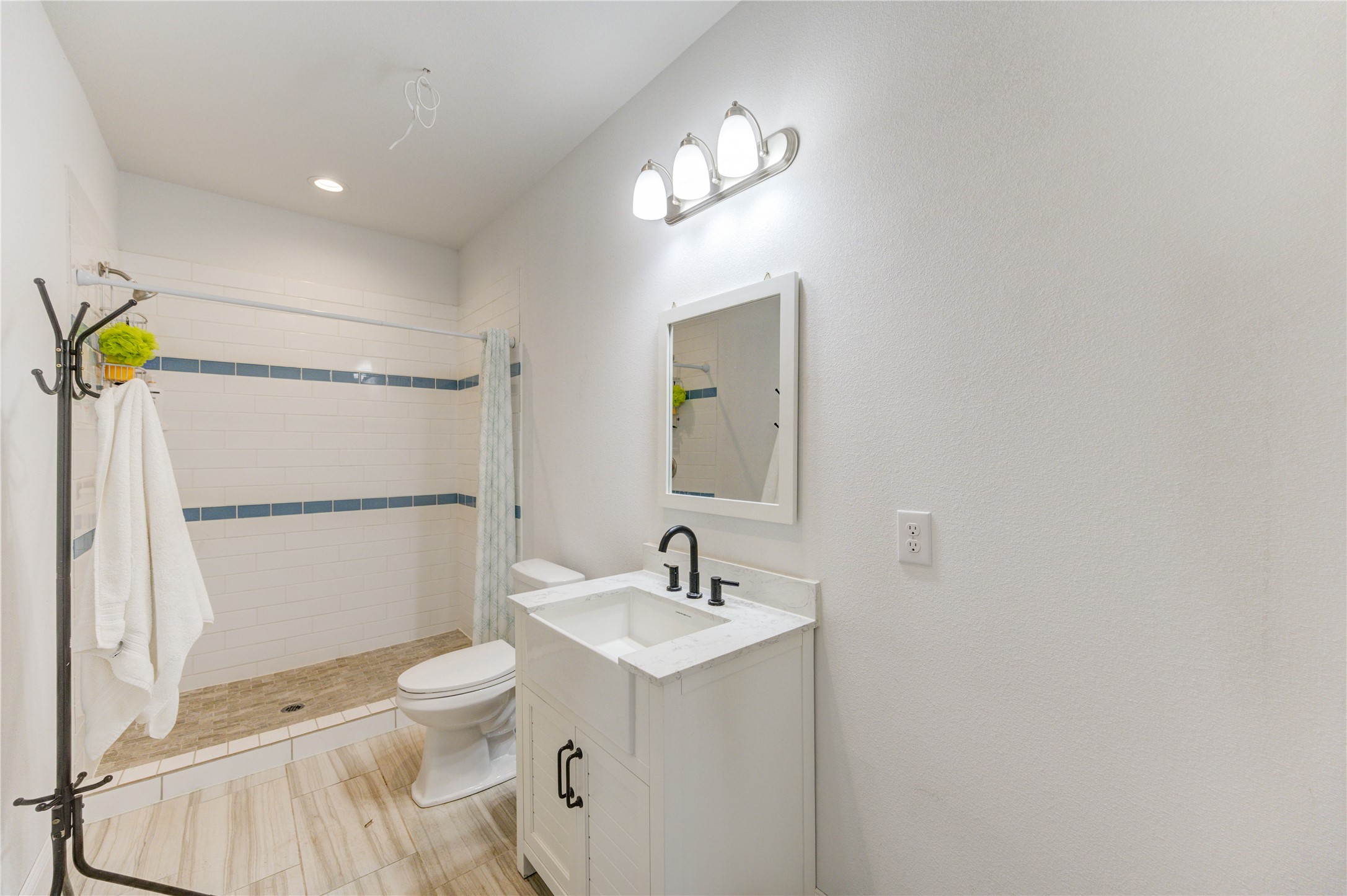8570 Sunny Side Road Hempstead, TX 77445 - Photo 24 of 50 a bathroom with a sink a toilet and shower