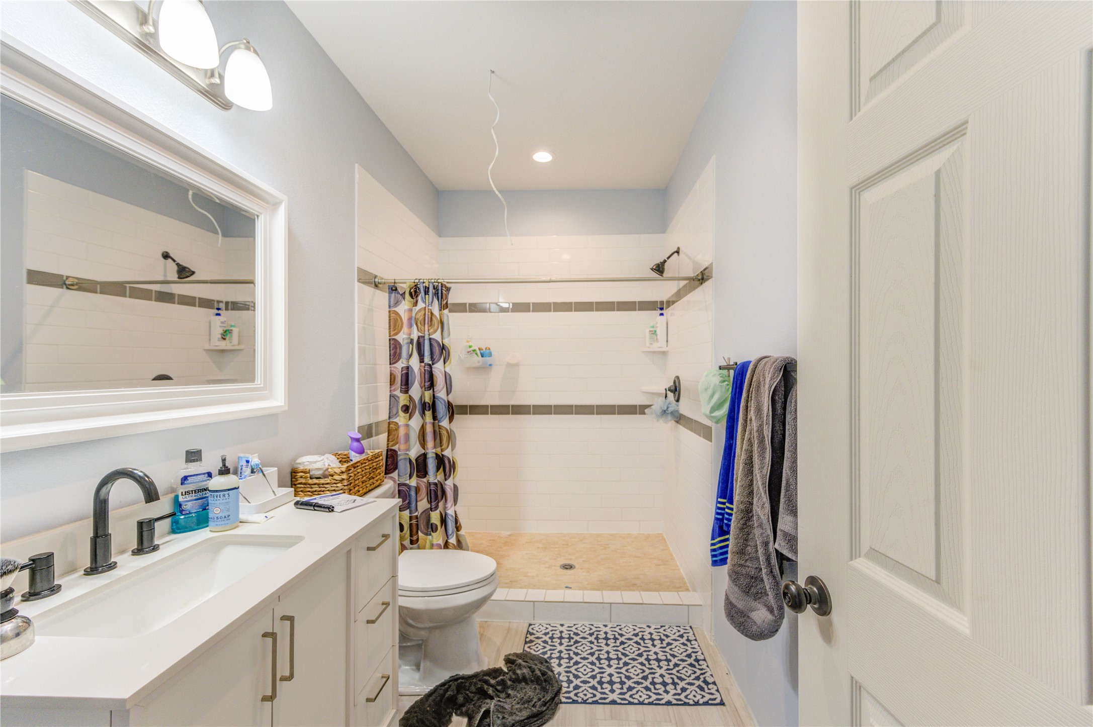8570 Sunny Side Road Hempstead, TX 77445 - Photo 27 of 50 a bathroom with a sink toilet and a mirror